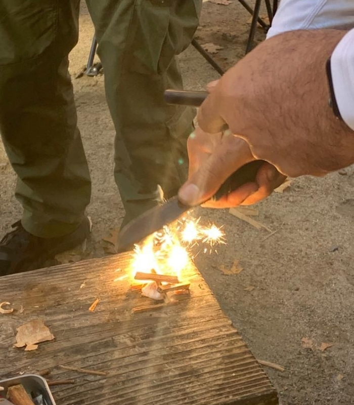 Showing initial sparks from starting a fire with tools at the Wilderness Survival Training in Ellenville, NY at the High Range Retreat.